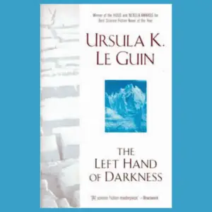 The Cover of Ursula K. Le Guin's The Left Hand of Darkness features a desert landscape with deep cracks and an abstract blue artwork that may be an ice sculpture.