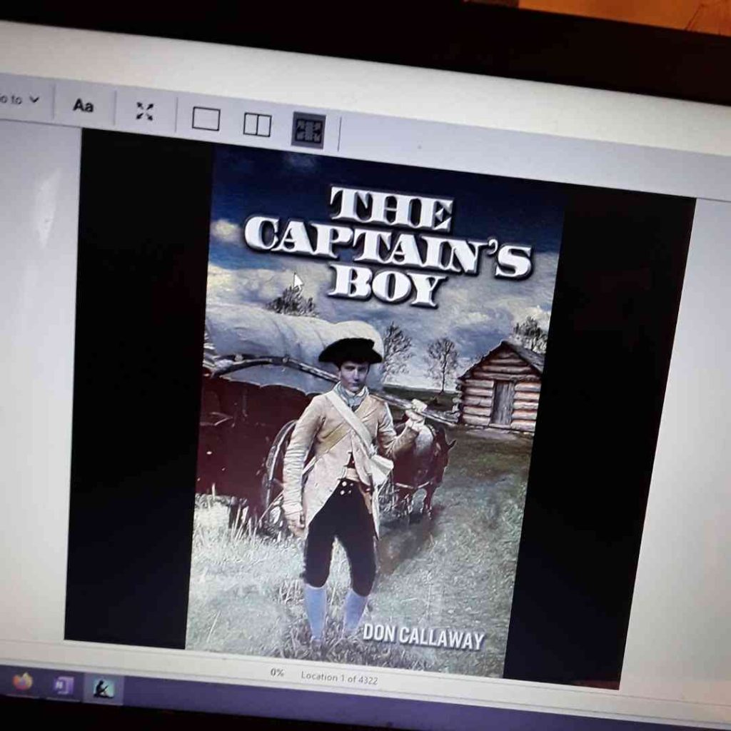 A screenshot of my kindle version of The Captain's Boy by Don Callaway The cover shows a man in revolutionary-era dress with a musket over one shoulder standing in front of a wagon and a log cabin.