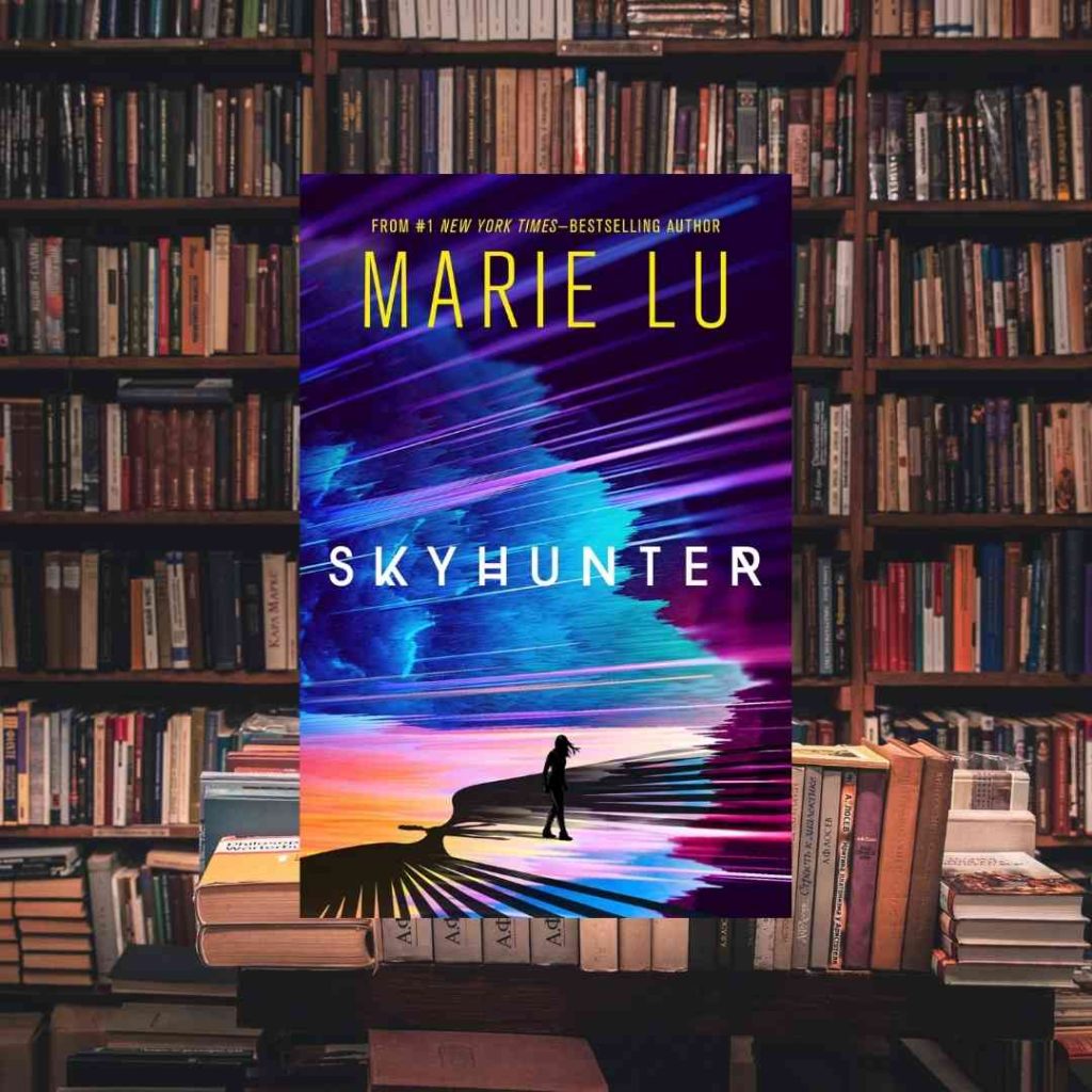 Marie Lu's Skyhunter appears larger than life on a library table. On the cover, a brightly colored, a silhouetted figure stands alone in a brightly colored almost alien landscape.
