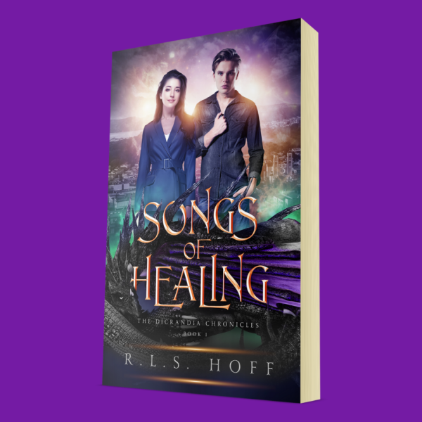A Paperback copy of R.L.S. Hoff's Songs of Healing. On the cover, a young couple stands in front of a plain with a modern city. A dragon curls up behind the title of the book.